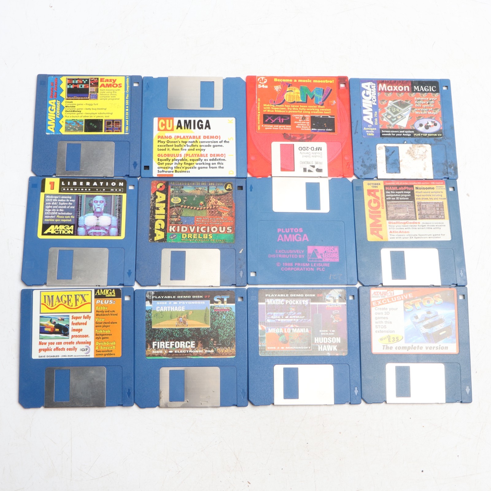 Commodore Amiga Plutos Game + 11 other Amiga Discs + Holder