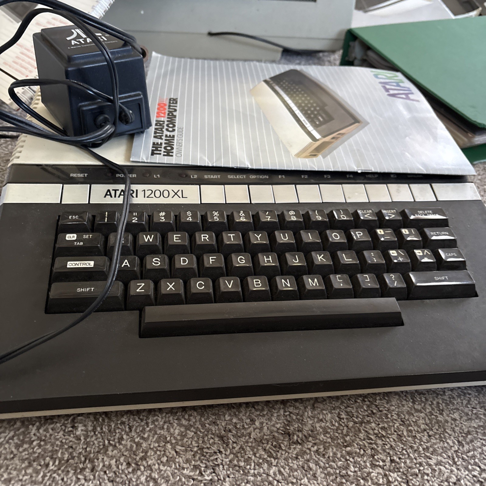 Atari 1200 XL home computer with original owners guide and power supply power on