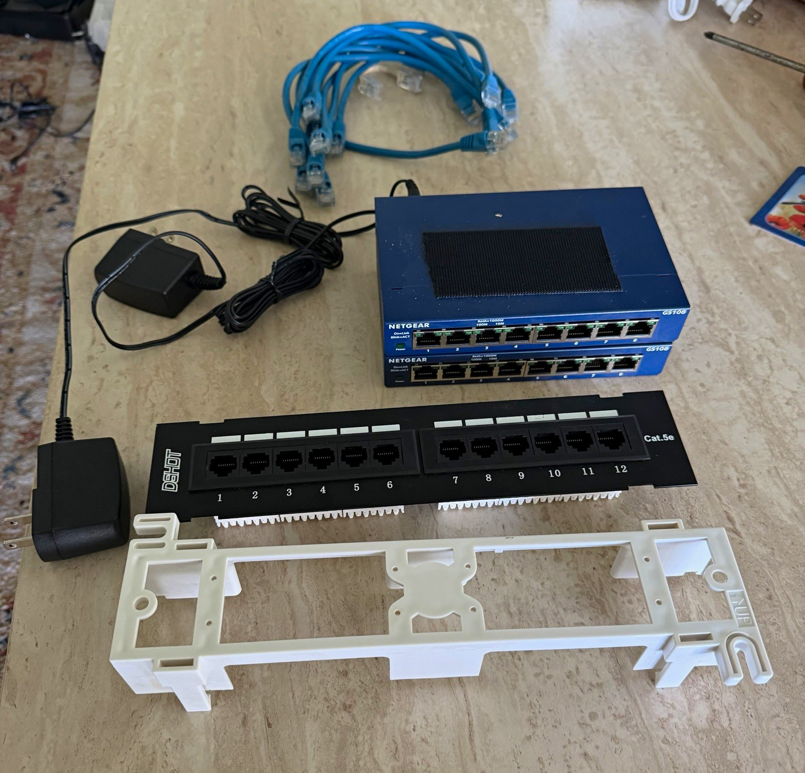 2 NETGEAR GS108v4 8-Port Gigabit Switches + 12-Port Cat5e Patch Panel Bundle