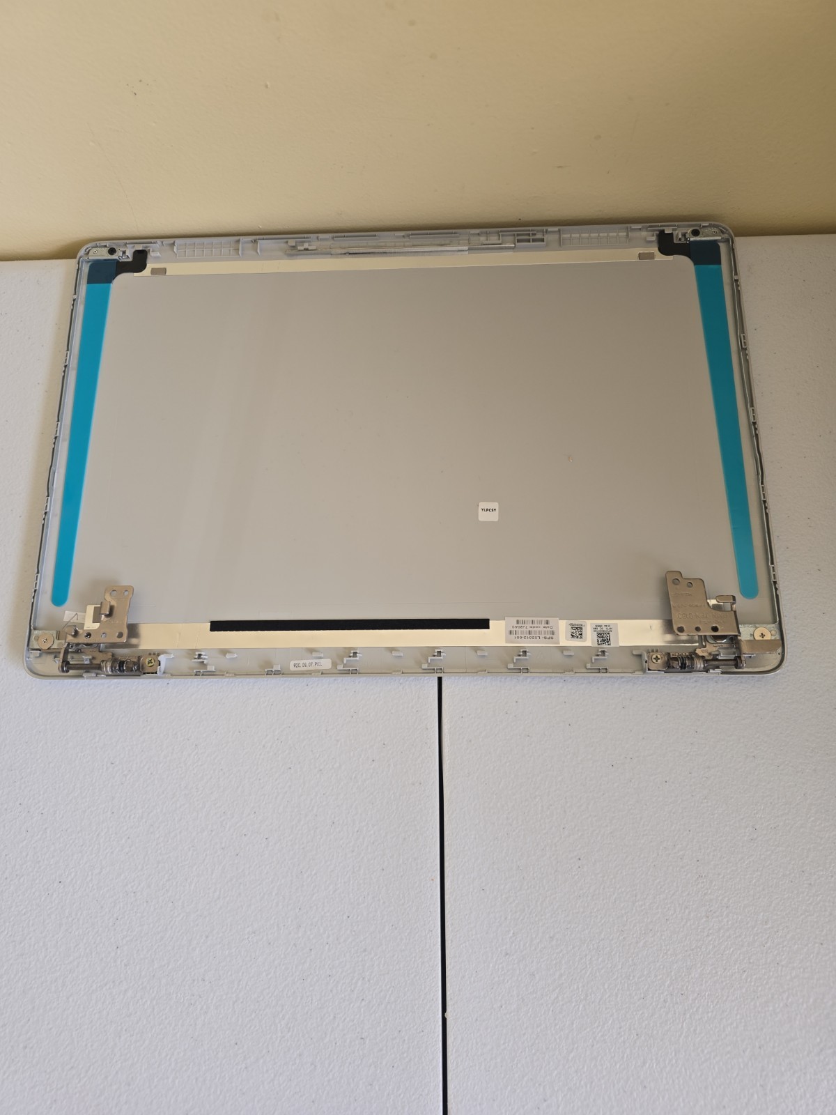 This is a silver HP 15-dw series laptop LCD back cover, model number...