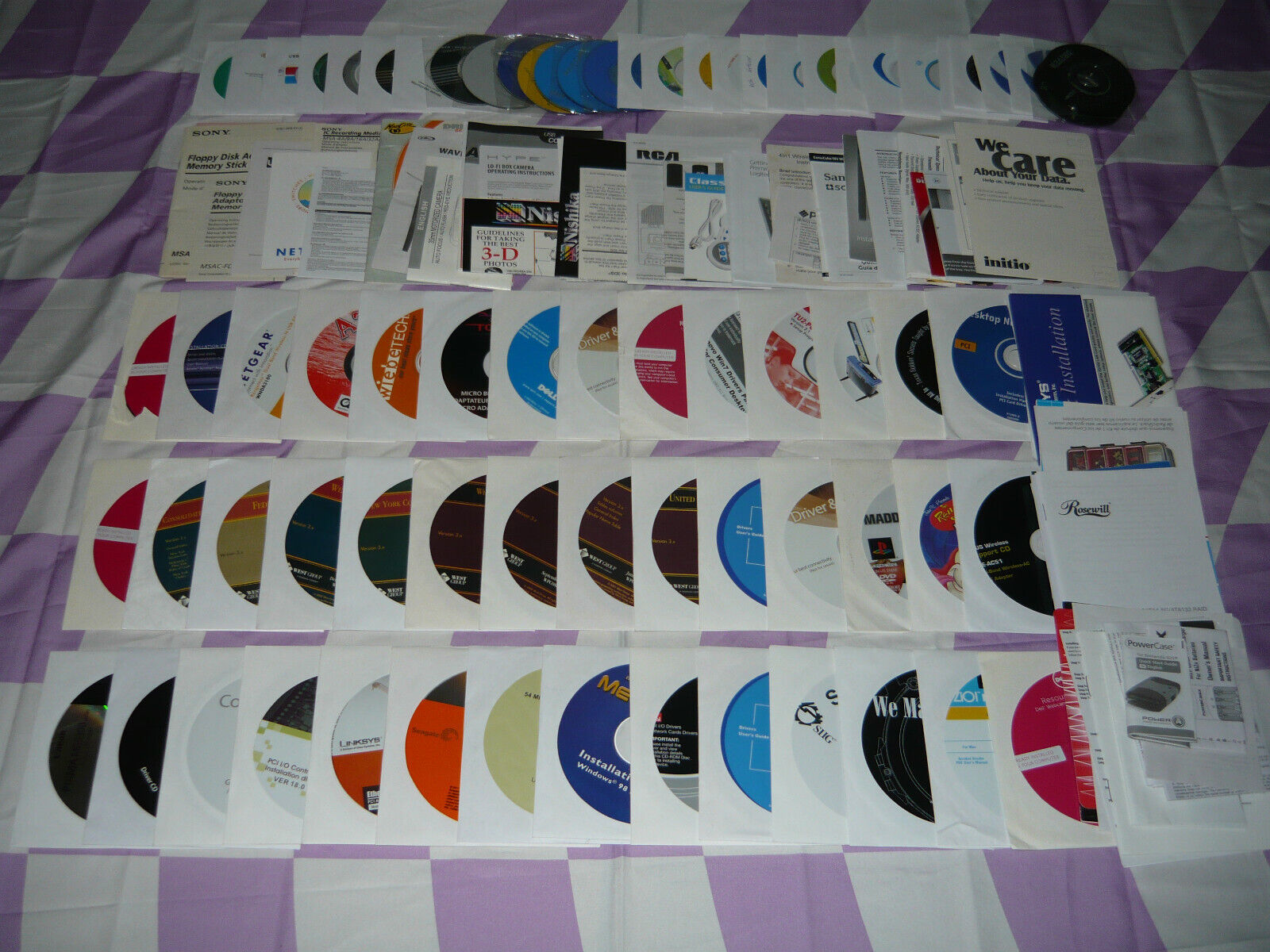 Huge Mixed Lot of Assorted Driver Software CDs and Manuals Used Description