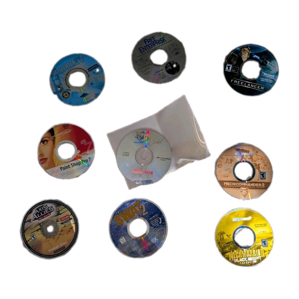 Vintage PC game and software discs from the late 1990s and early 2000s.