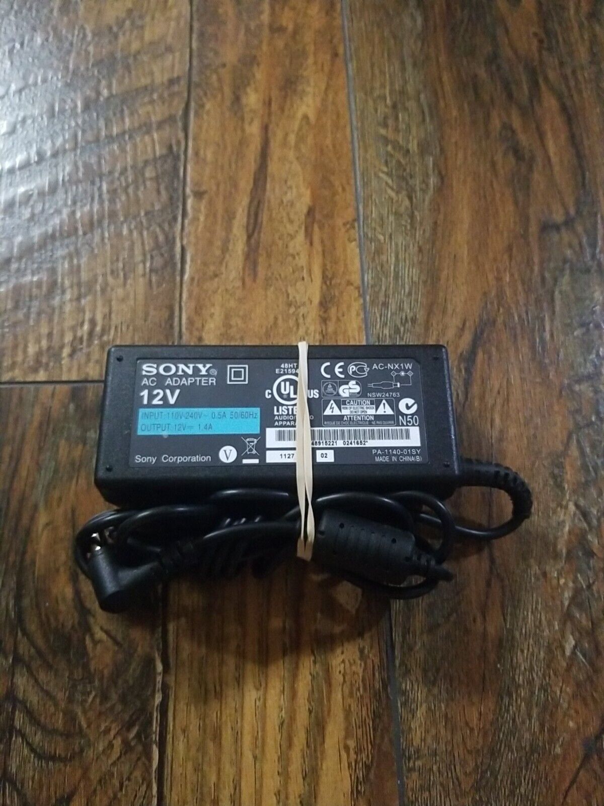 (EQ) Original OEM Sony AC Adapter Charger AC-NX1W 12V 1.4A