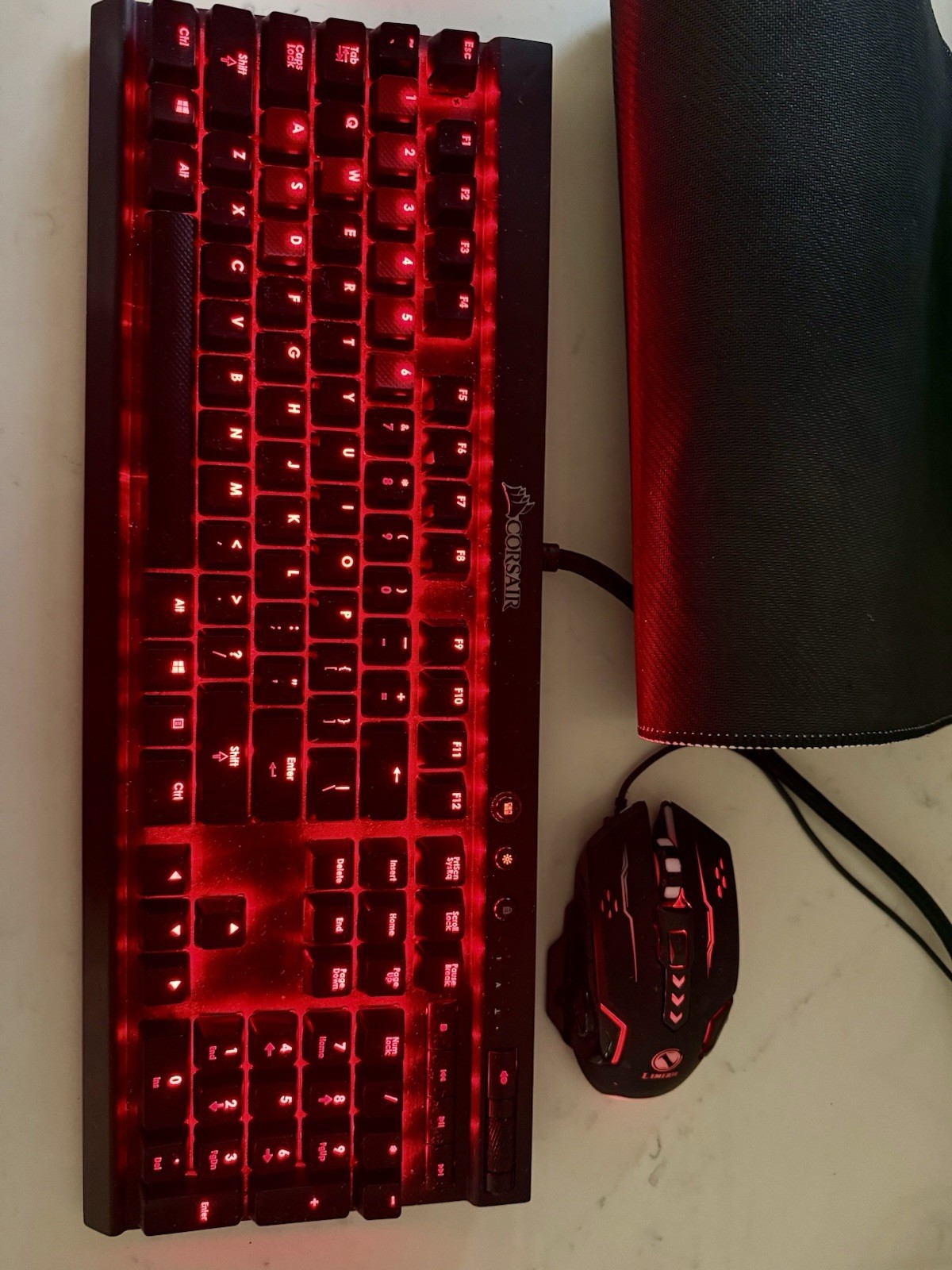 Corsair K70 mechanical gaming keyboard and a gaming mouse and a large mouse pad