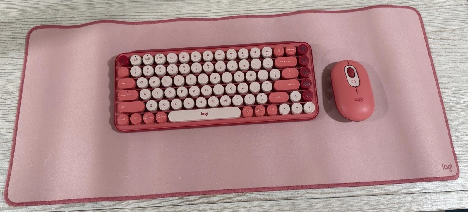 Logitech Compact Wireless Keyboard Hot pink and white , keyboard mat, and mouse