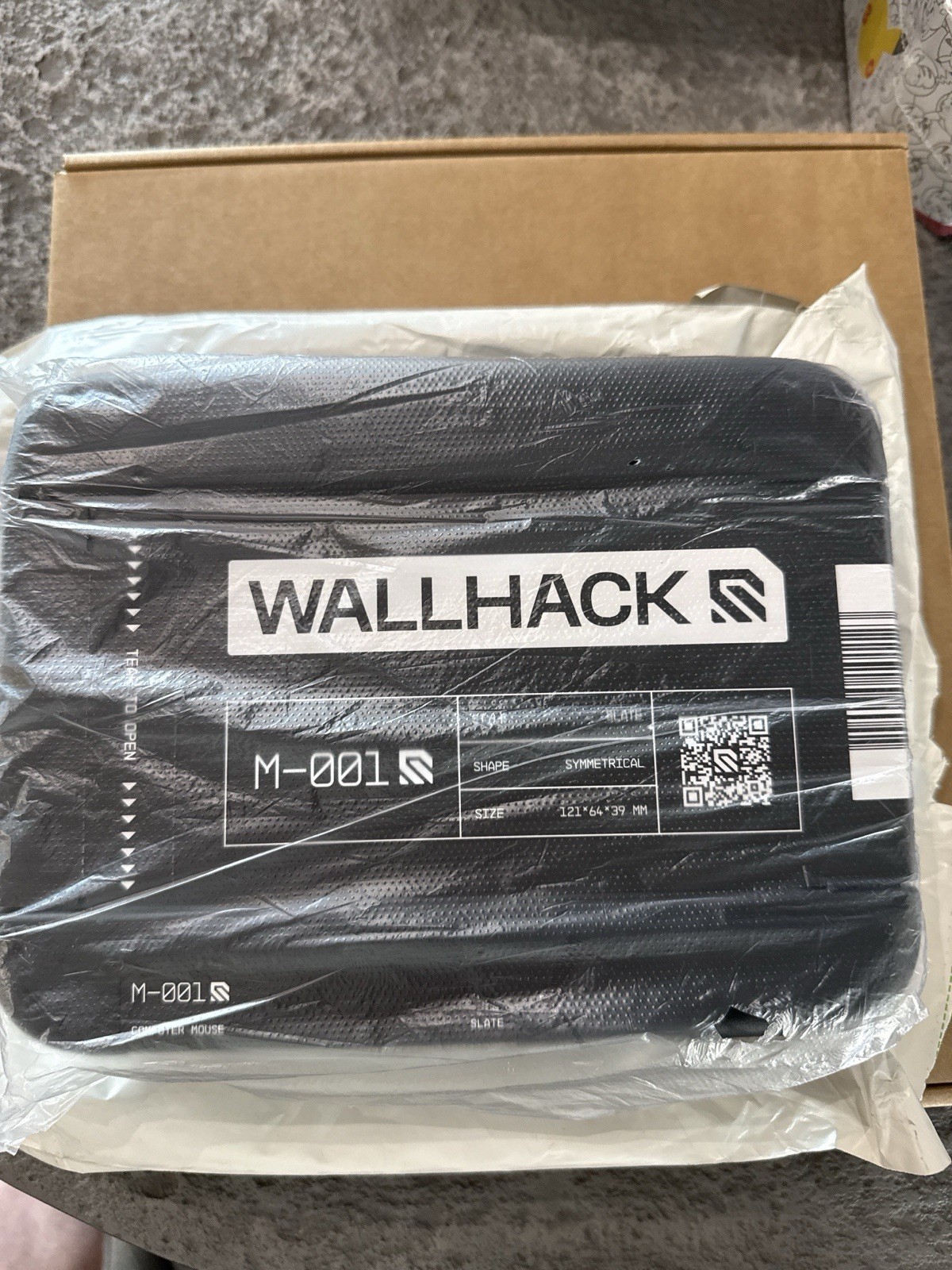Wallhack M-001 Gaming Mouse in hand and ready to ship