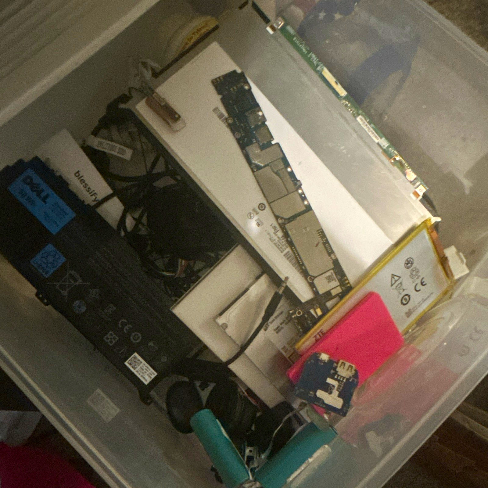Lot of random computer/tech parts from batteries to mother boards to screens