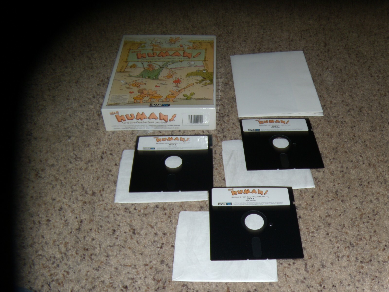 the Humans IBM PC Game on 5.25" disks with box and poster - tested