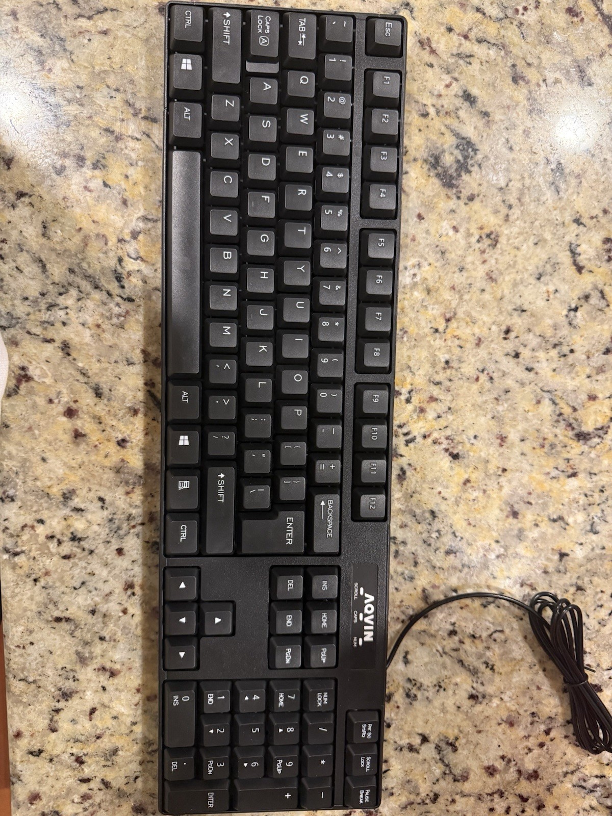 This item is an AQVIN brand wired computer keyboard with a USB interface