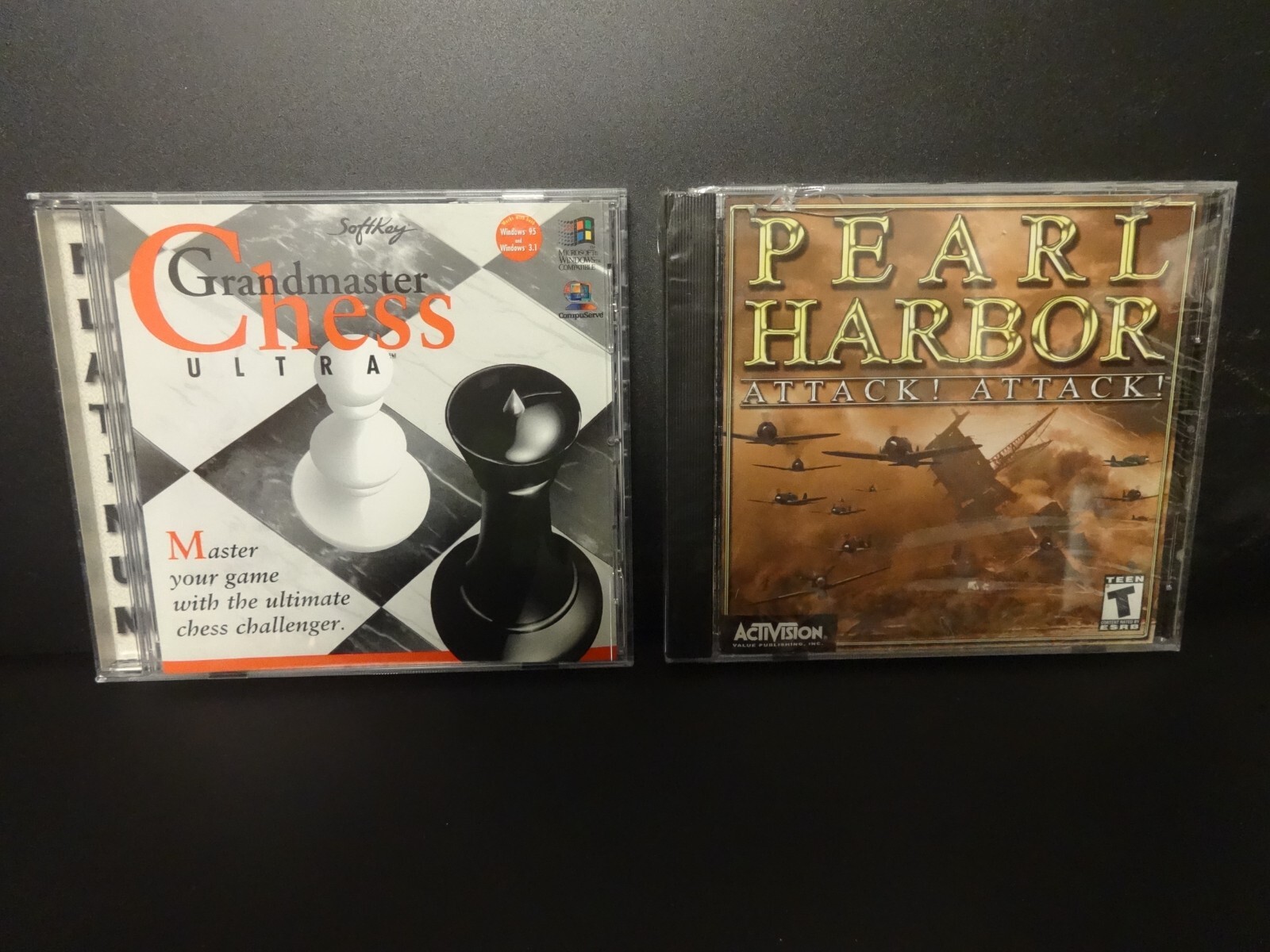 2 CD-ROM Games - SoftKey Grandmaster Chess & Activision Pearl Harbor - w/ cases