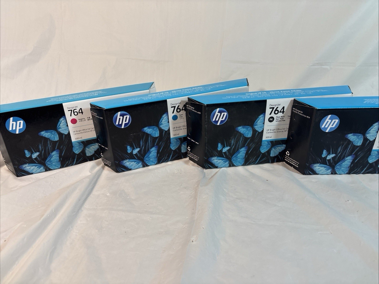 Lot Of 4 HP 764 300ml Inks. (2)BLK, (1)CYAN, (1)Magenta. Exp 2023-2026 Unopened