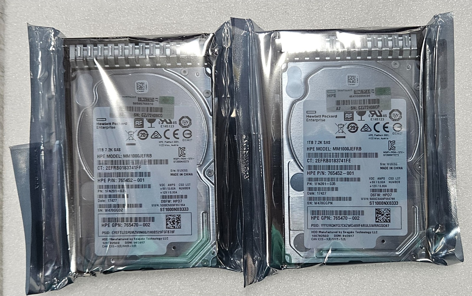 Lot of 2 HPE 765872-001 1TB SAS 7.2K SFF SC 512e DS HDD Drives - Refurbished