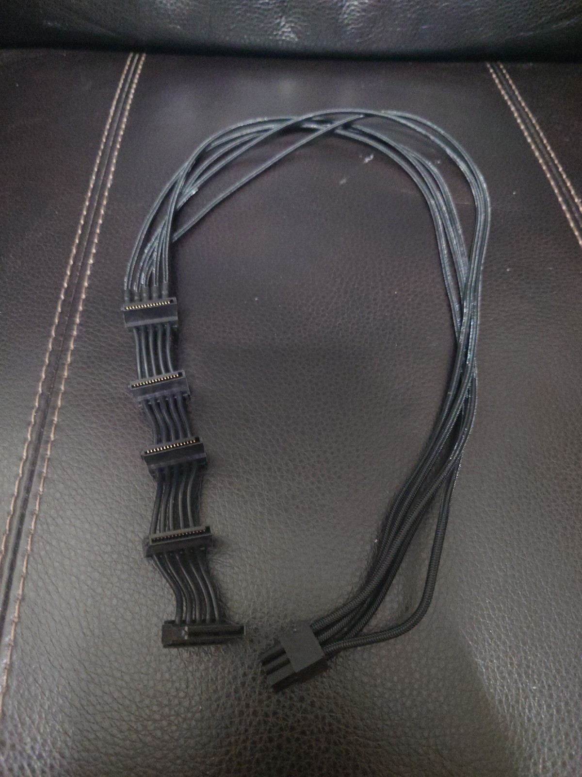 The PCI-e 6pin to 5 SATA power supply cable is only for Corsair AXi Series