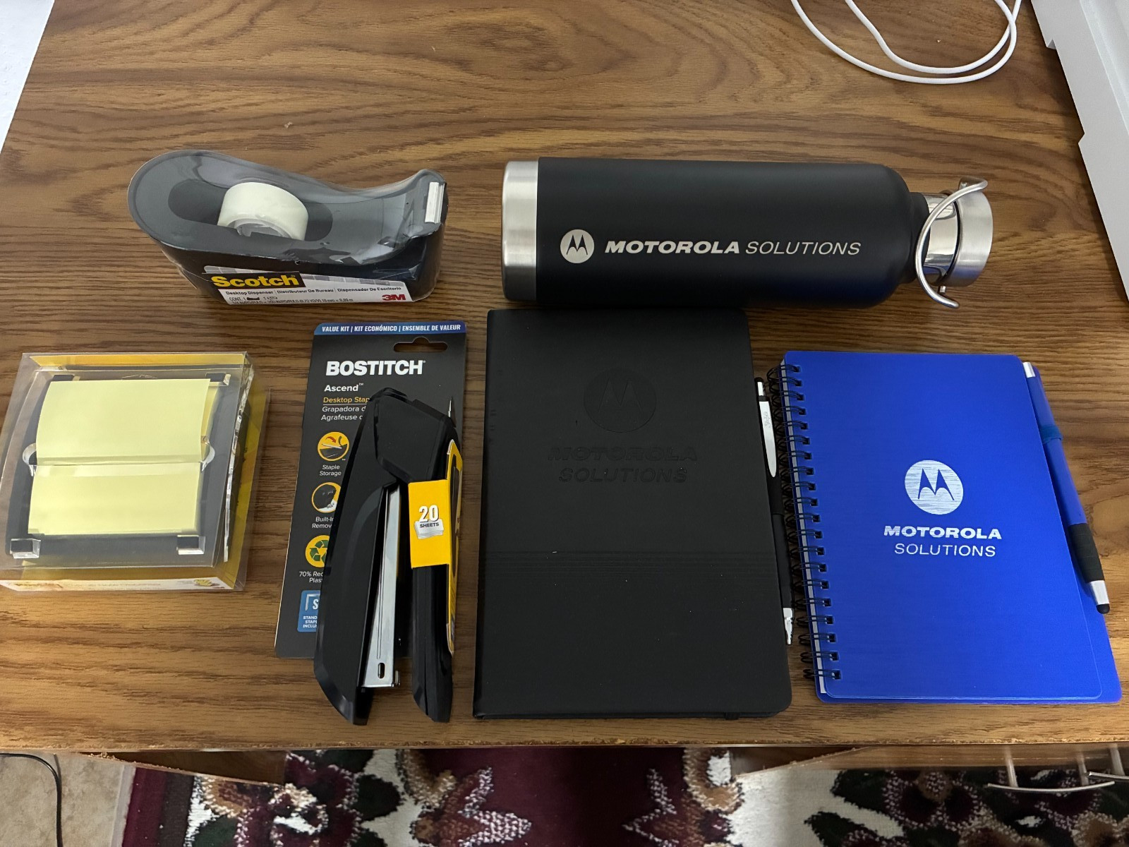 Motorola Solutions Water Bottle, Notebook, Bostitch Stapler, Scotch Tape, Posts