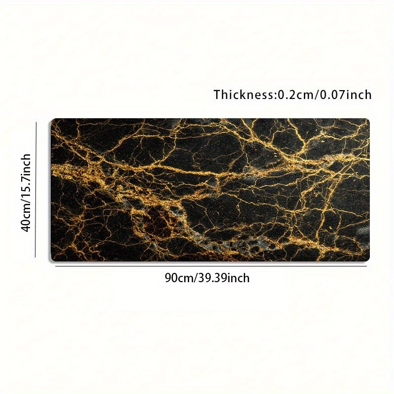 A Large Gaming Mouse Pad Featuring a Luxurious Black And Golden Marble Texture
