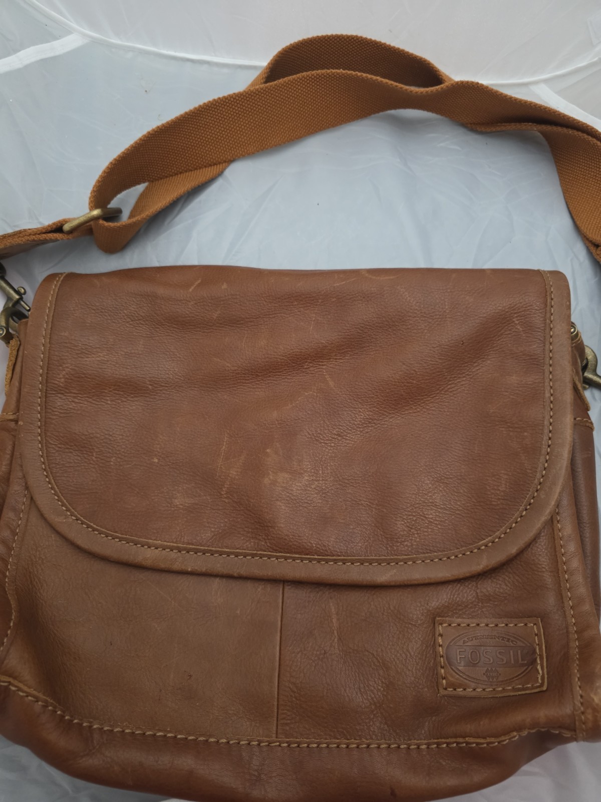 Fossil leather messenger/laptop bag fabric strap