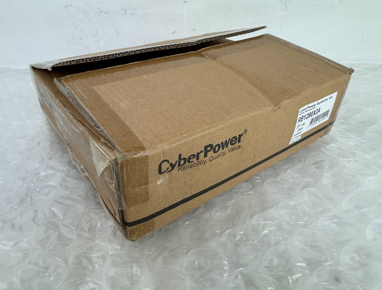 New in Box RB1280X2A UPS Replacement Battery Cartridge