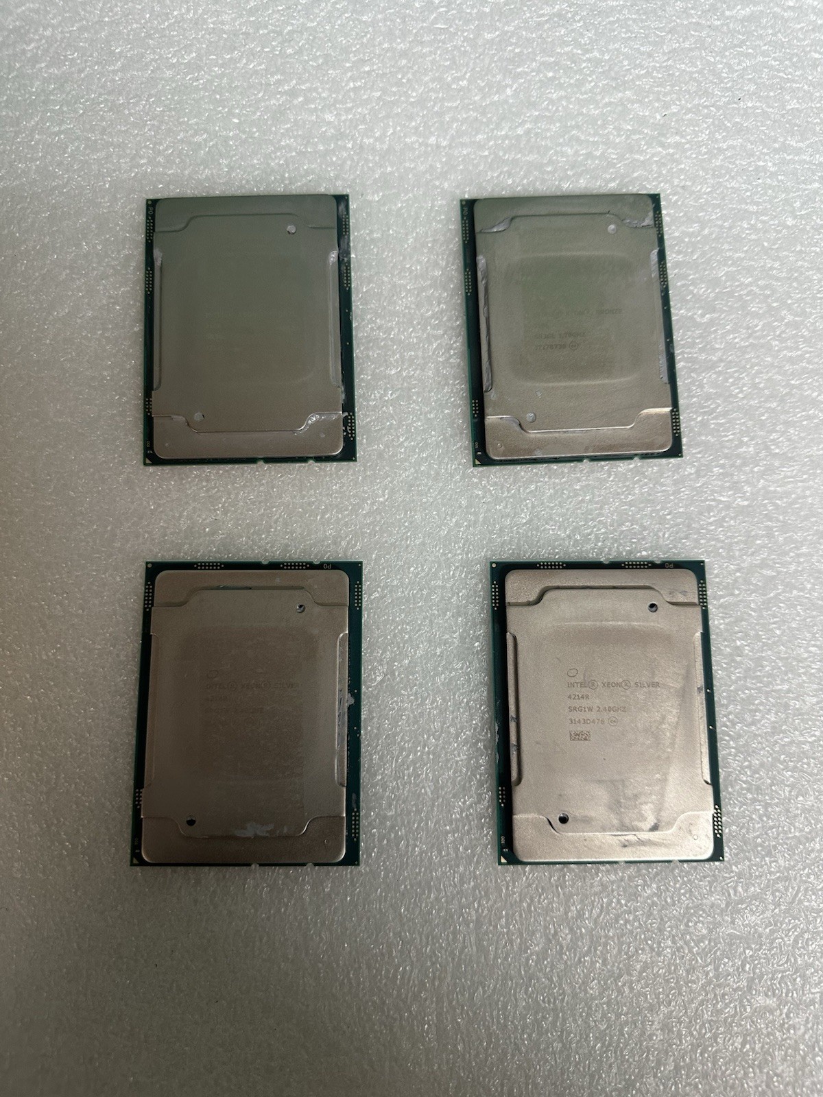 Lot of 4 Intel Xeon Server CPUs – 2x Silver 4214R SRG1W + 2x Bronze 3106 SR3GL