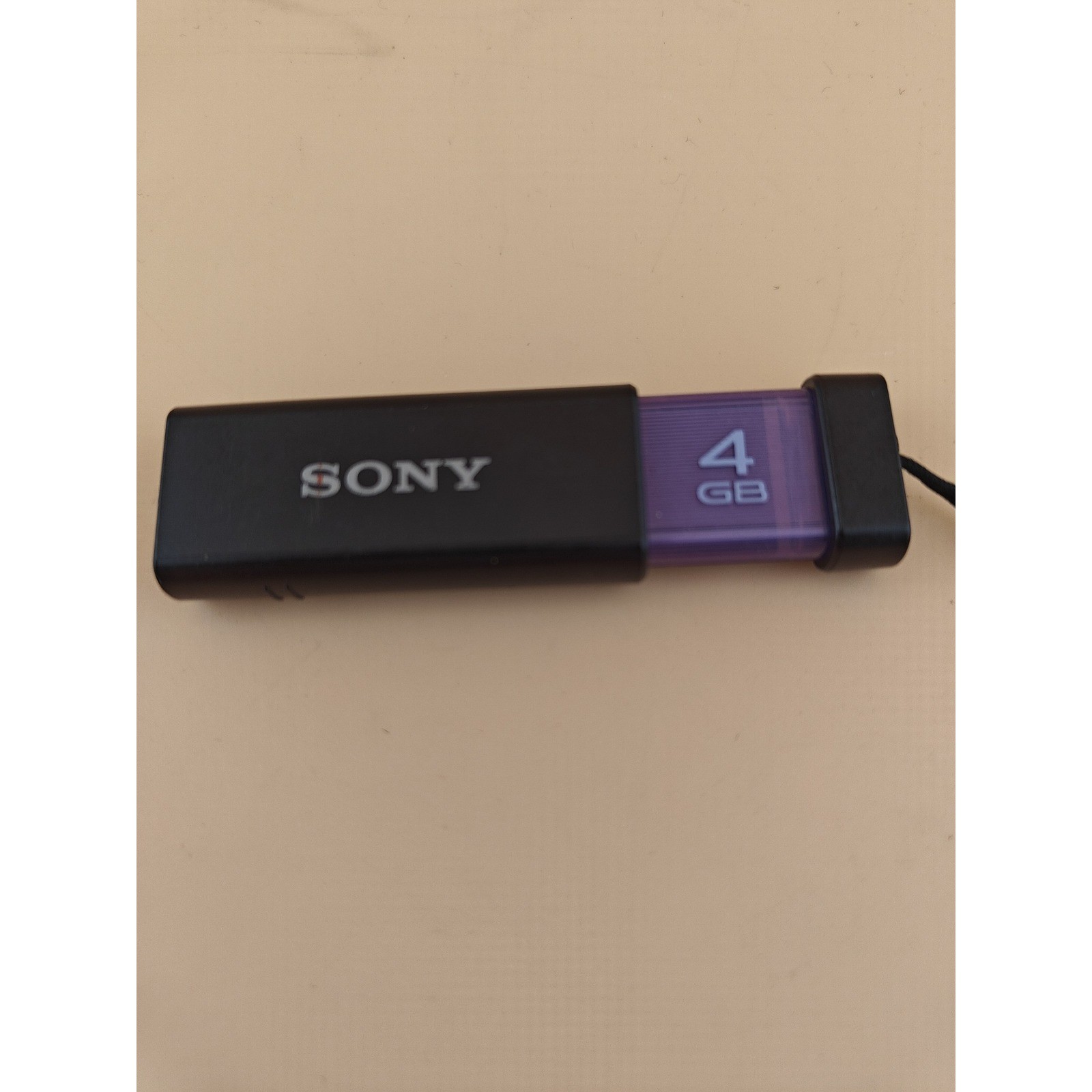 Sony Micro Vault Click USM4GL 4GB USB Flash Drive Black Purple Memory Stick