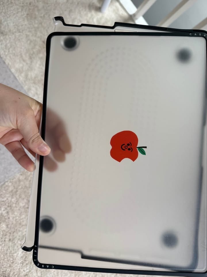 Casetify macbook pro 14 case, with the red apple in the middle, clear case.