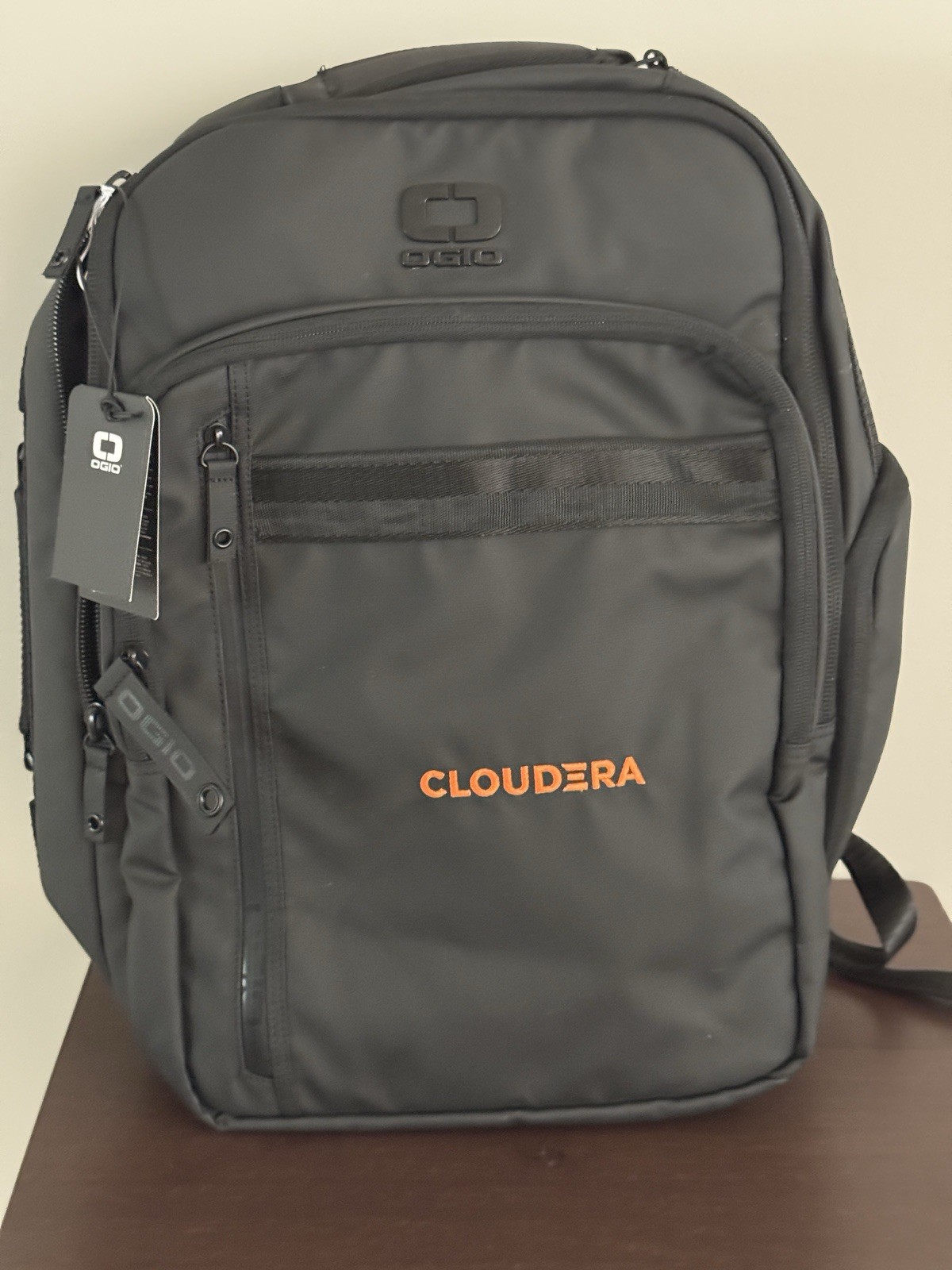 OGIO Commuter XL Pack in the blacktop colorway Cloudera logo on the front pocket