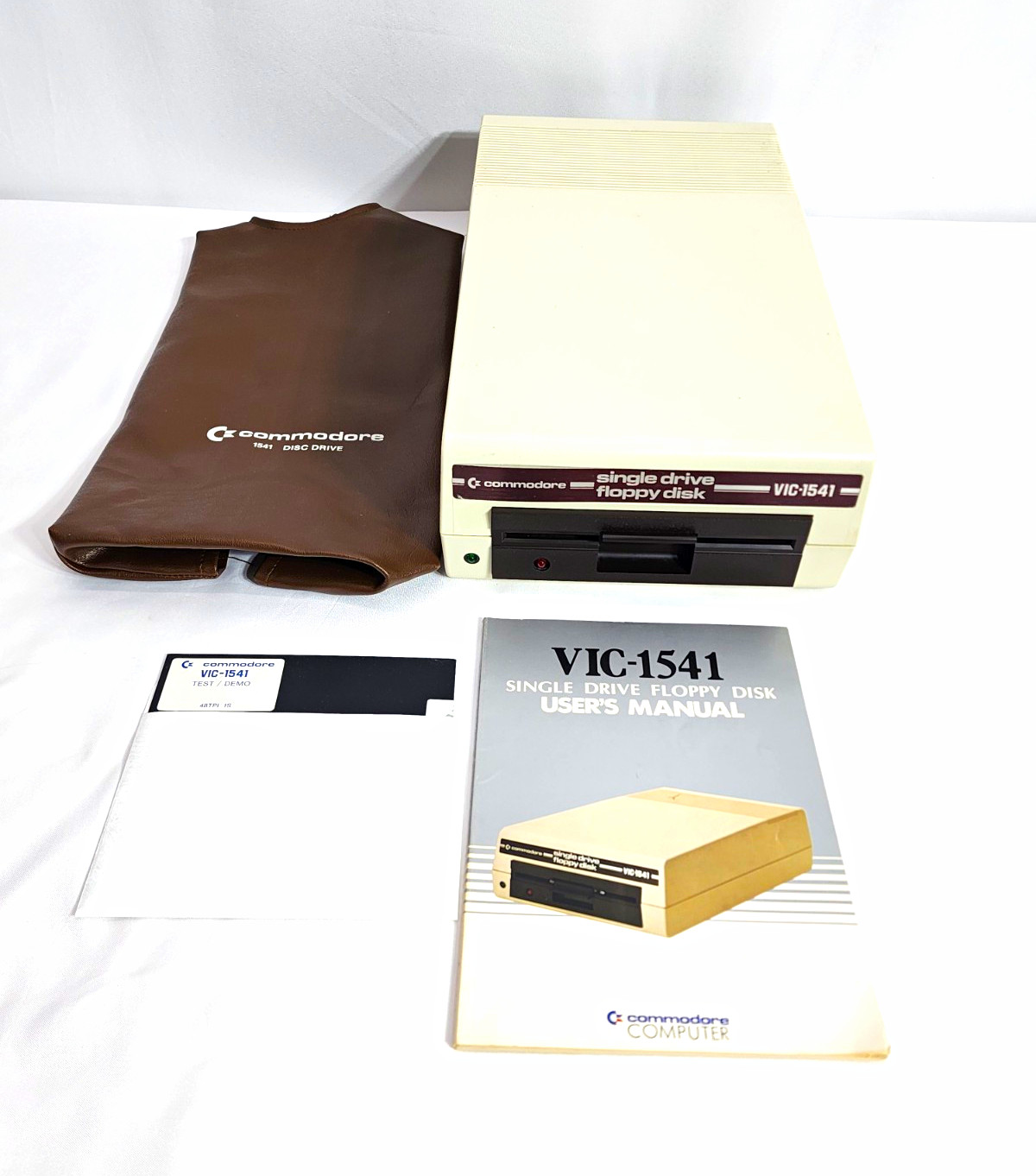 Commodore VIC-1541 Floppy Disk Drive C64 VIC-20 + Manual Demo Disk & Dust Cover