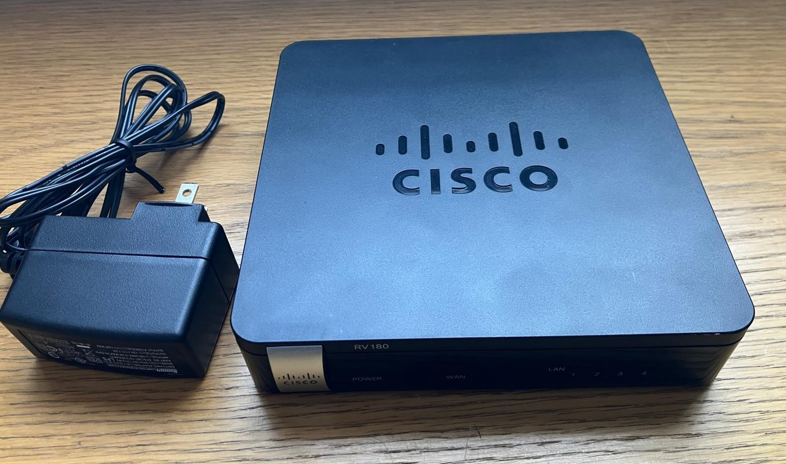 Cisco RV180 800 Mbps 4-Port Gigabit VPN Router  + SYS1381-1212-W2 Power Adapter