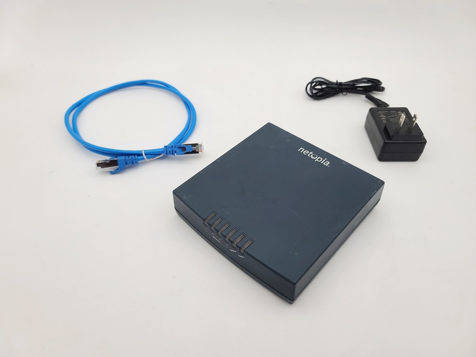 NETOPIA CAYMAN 3341-ENT 4-PORT 10/100 DSL MODEM ROUTER WITH AC POWER ADAPTER
