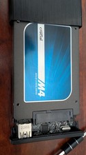 Crucial M4 128GB SSD in Sabrent enclosure with Case Logic carrying case picture