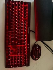 Corsair K70 mechanical gaming keyboard and a gaming mouse and a large mouse pad picture