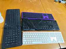Bundle of 4 assorted computer keyboards as shown in the photos. Please note tha picture