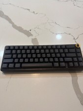 Black creamy color changing gaming keyboard with padding on the bottom  picture