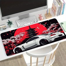 A Large Gaming Mouse Pad Featuring a White Sports Car And Cherry Blossom Desig picture