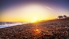 Landscape sea beach stones orange sky pebbles lens flare Custom Gaming Mat Desk picture