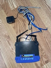 Linksys WRK54G 54 Mbps 4-Port 10/100 Wireless G Router Power Source And Cables picture