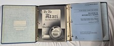 Set of original Atari 400/800 technical documentation housed in a vintage 3-ring picture