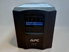 Pre-owned APC Smart-UPS 750, model SMT750. Unit powers on and LCD display is wor picture