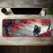 A Large Electronic Sports Gaming Mouse Pad Featuring a Silver Armored Warrior picture